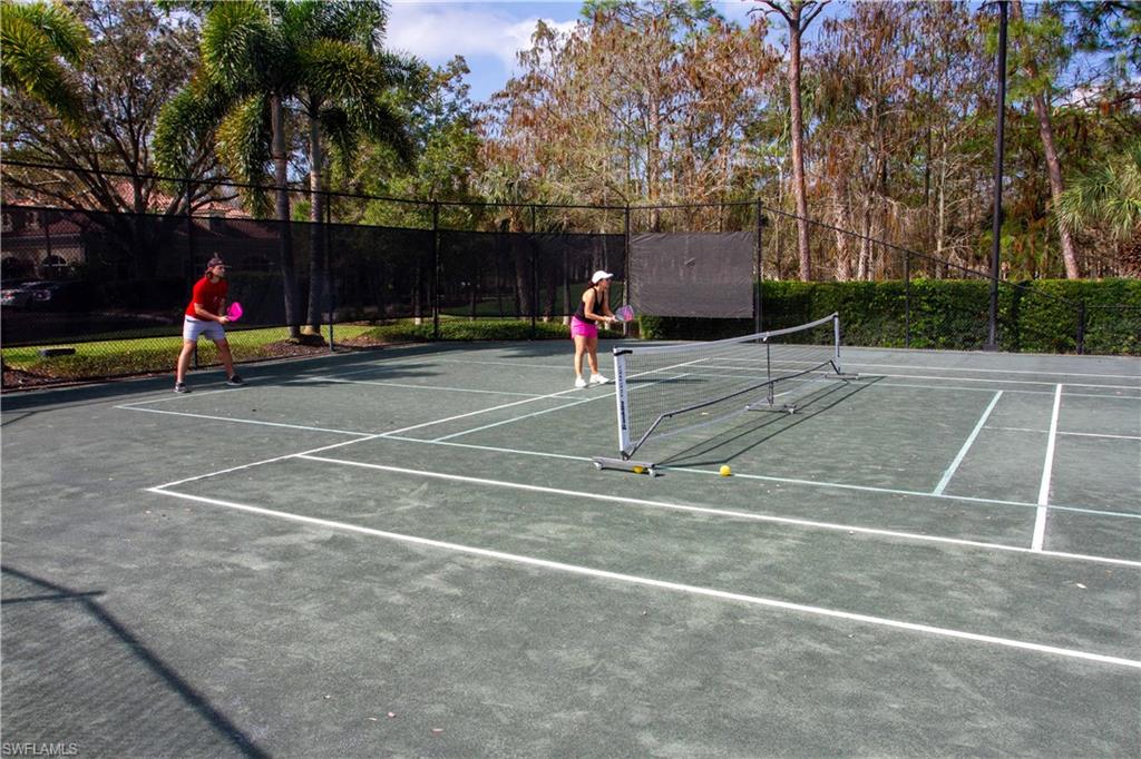 8229 Allendale Court Naples, FL 34120 - Photo 44 of 50 a view of a tennis court