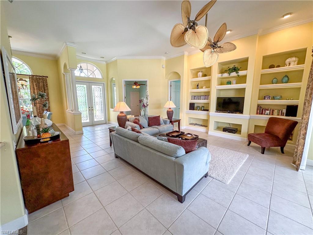 8229 Allendale Court Naples, FL 34120 - Photo 6 of 50 a living room with furniture and a large window