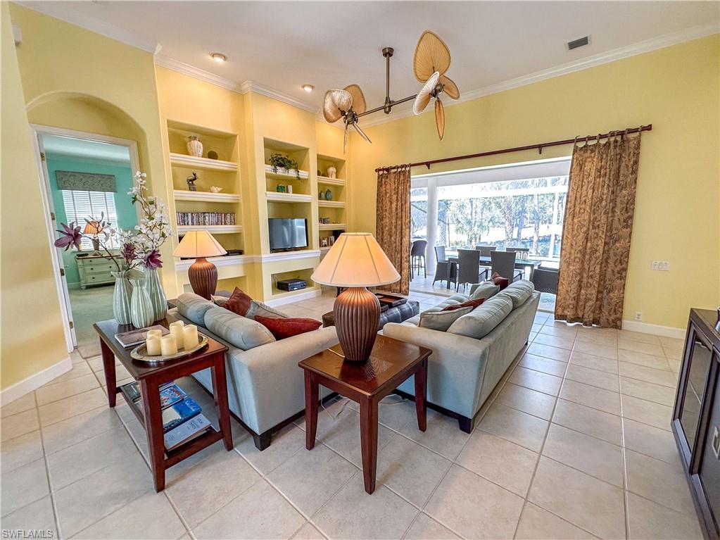 8229 Allendale Court Naples, FL 34120 - Photo 7 of 50 a living room with furniture and a large window