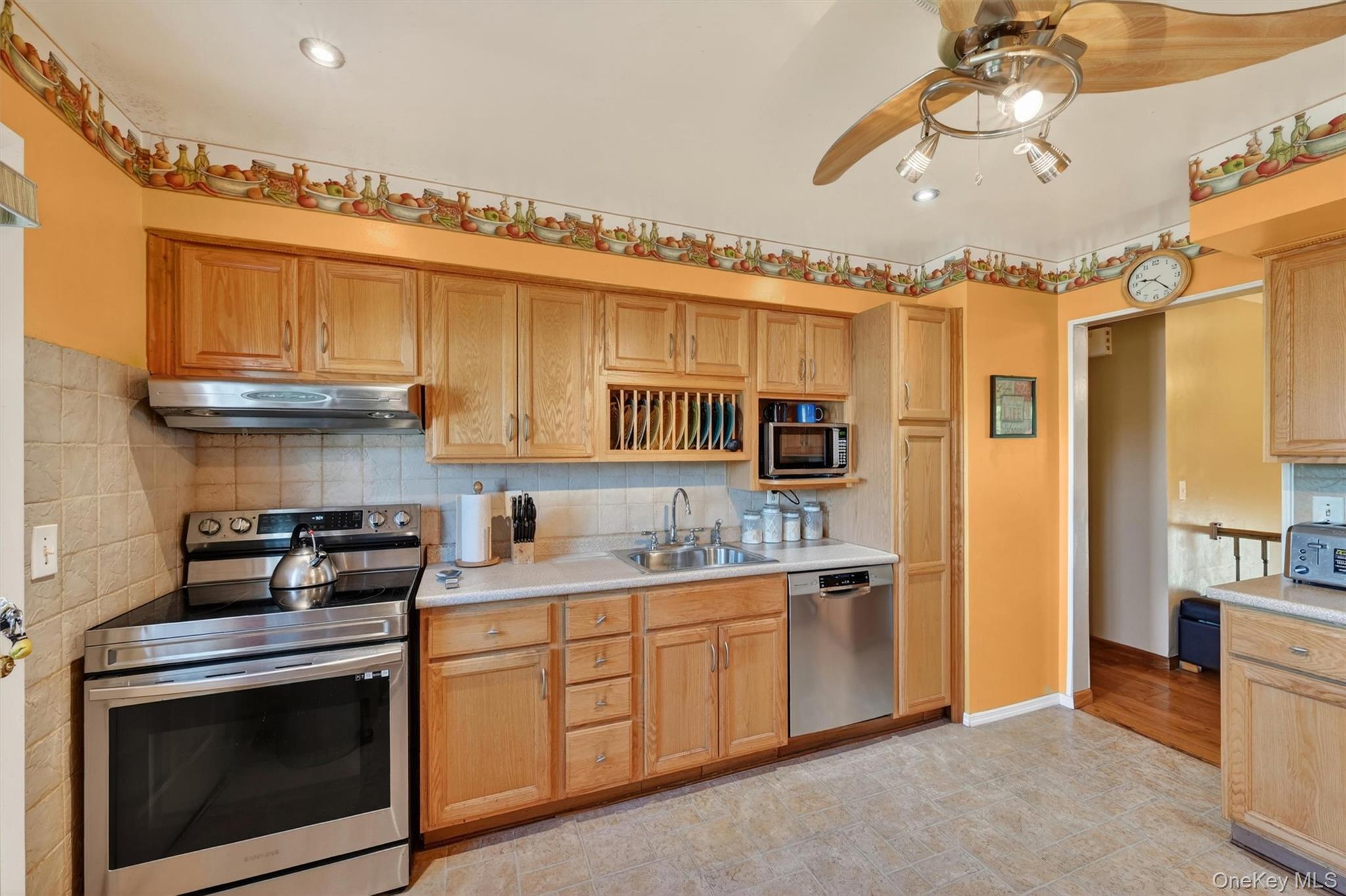 122 Rolling Meadows Road Middletown, NY 10940 - Photo 12 of 47 a kitchen with stainless steel appliances granite countertop a stove a sink and a refrigerator