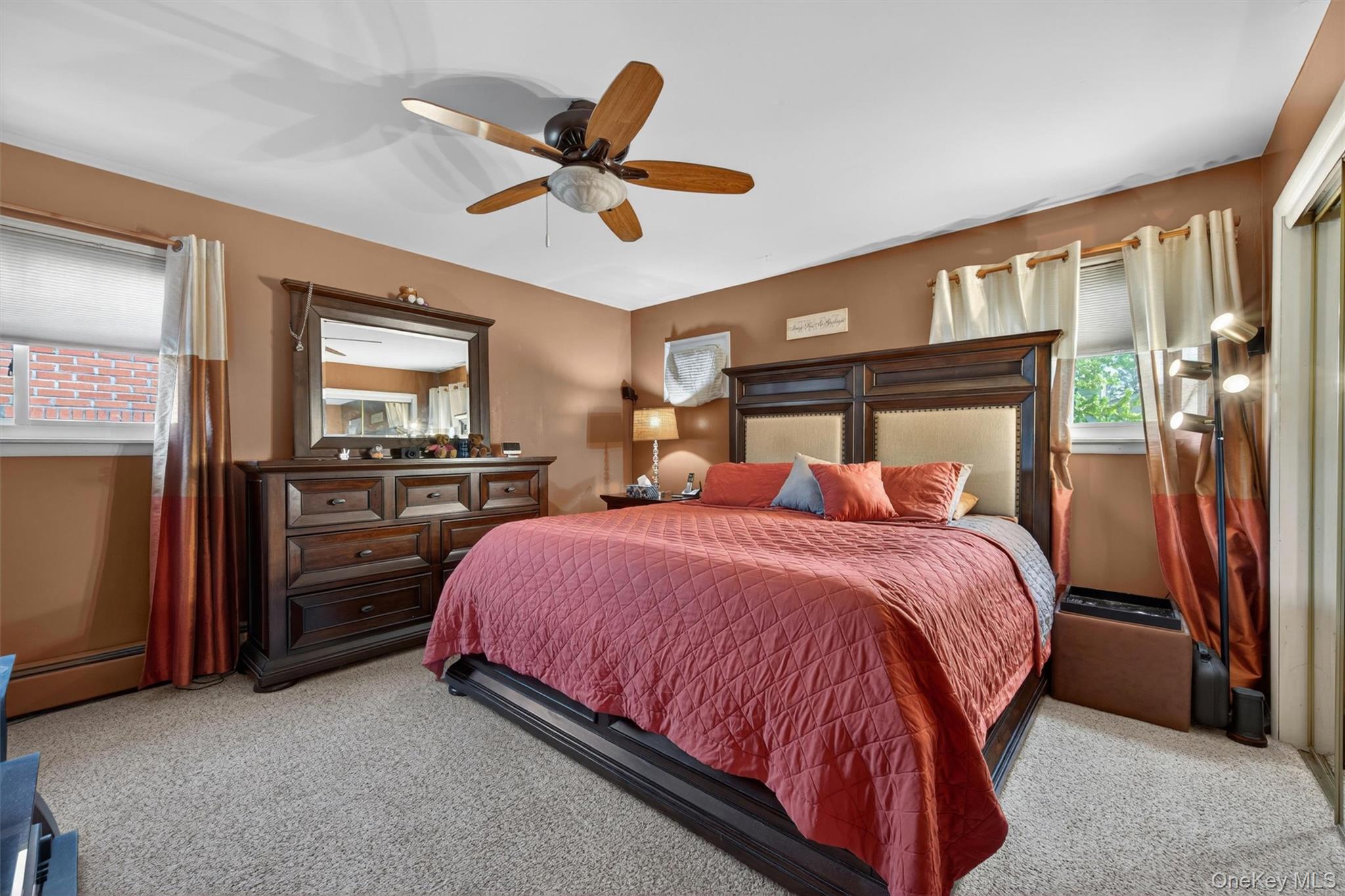 122 Rolling Meadows Road Middletown, NY 10940 - Photo 16 of 47 a bed room with a bed and a ceiling fan