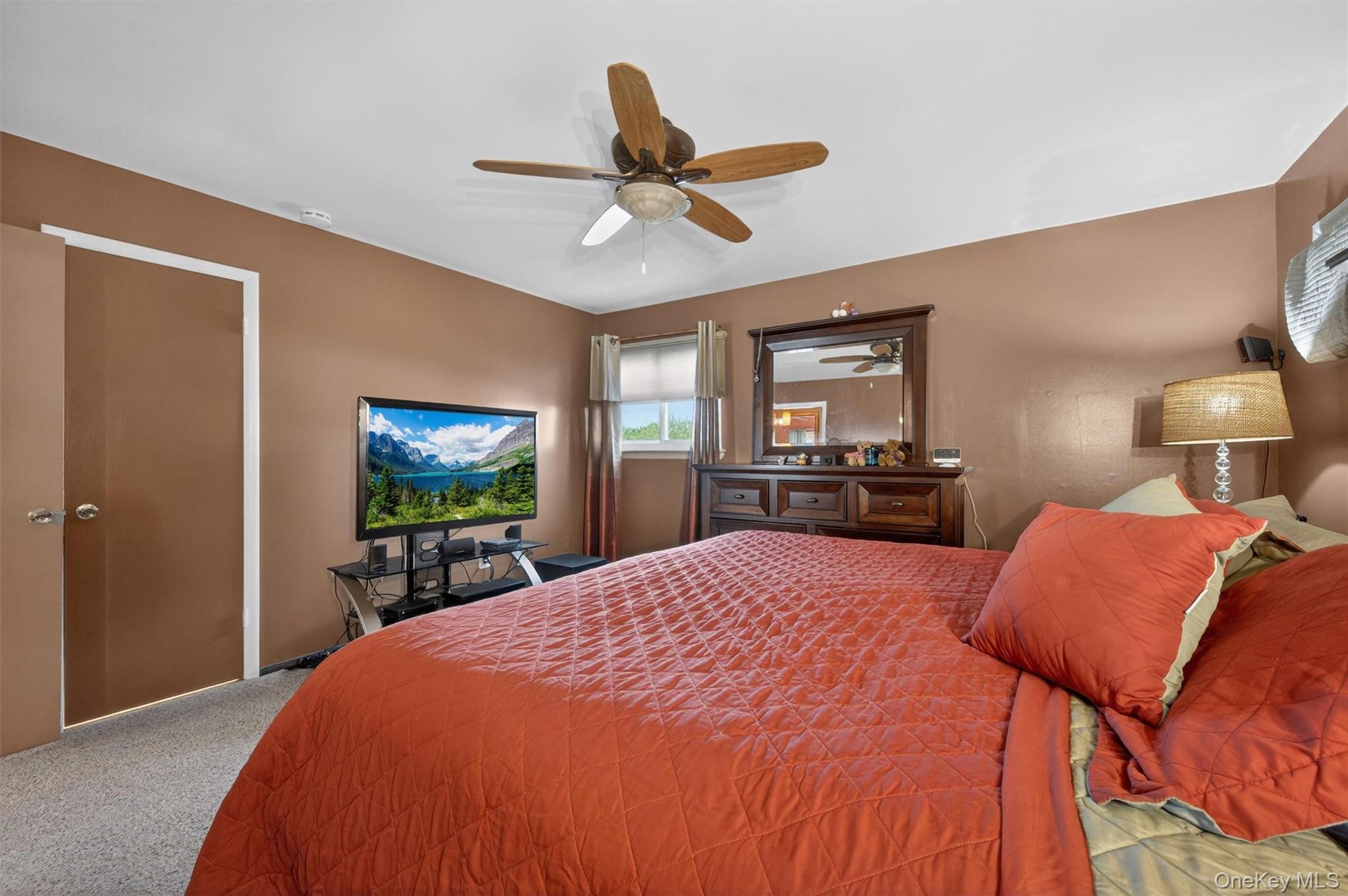122 Rolling Meadows Road Middletown, NY 10940 - Photo 19 of 47 a bed room with a bed a television and a large window