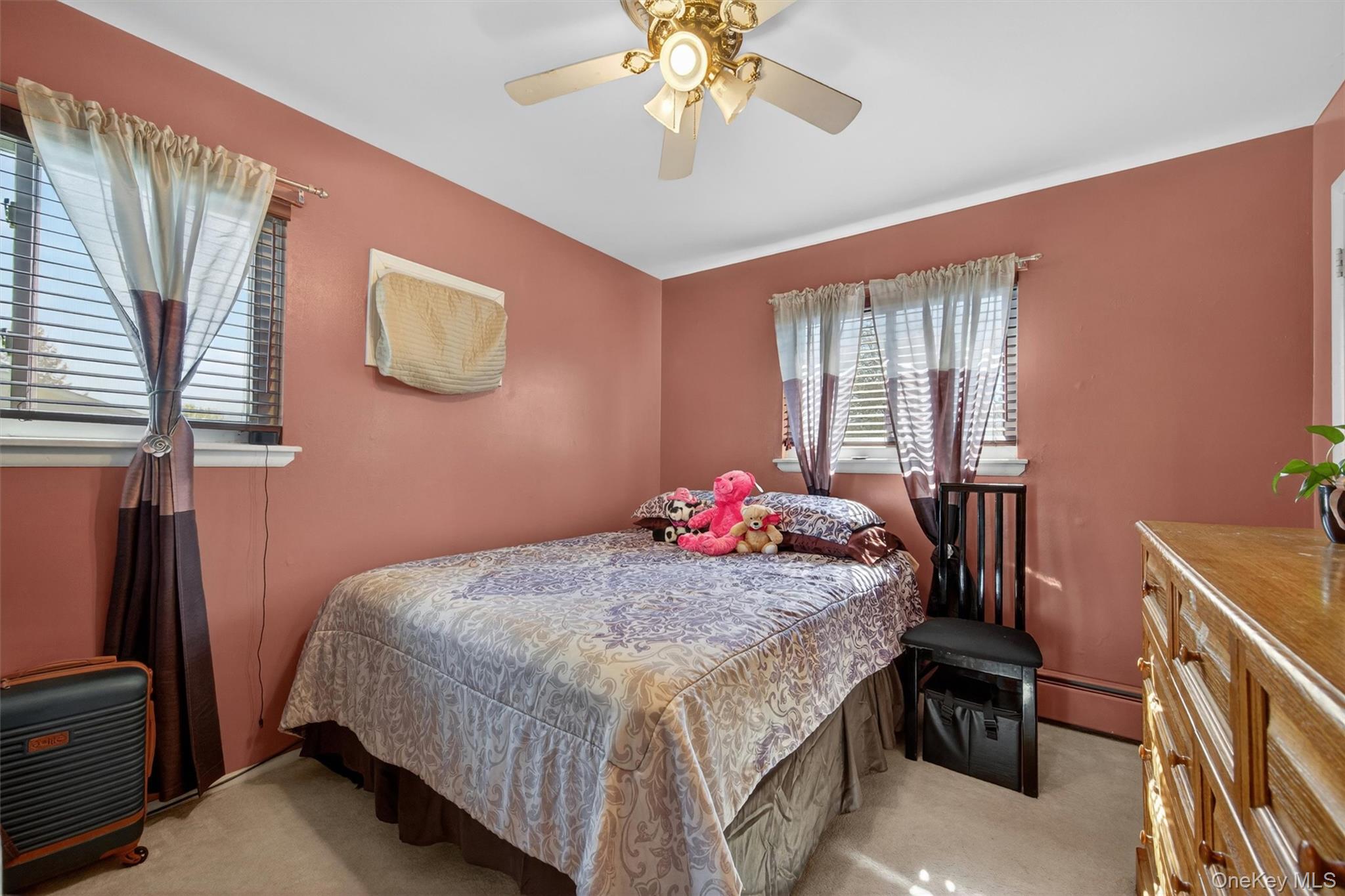 122 Rolling Meadows Road Middletown, NY 10940 - Photo 20 of 47 a bedroom with a bed and a chandelier