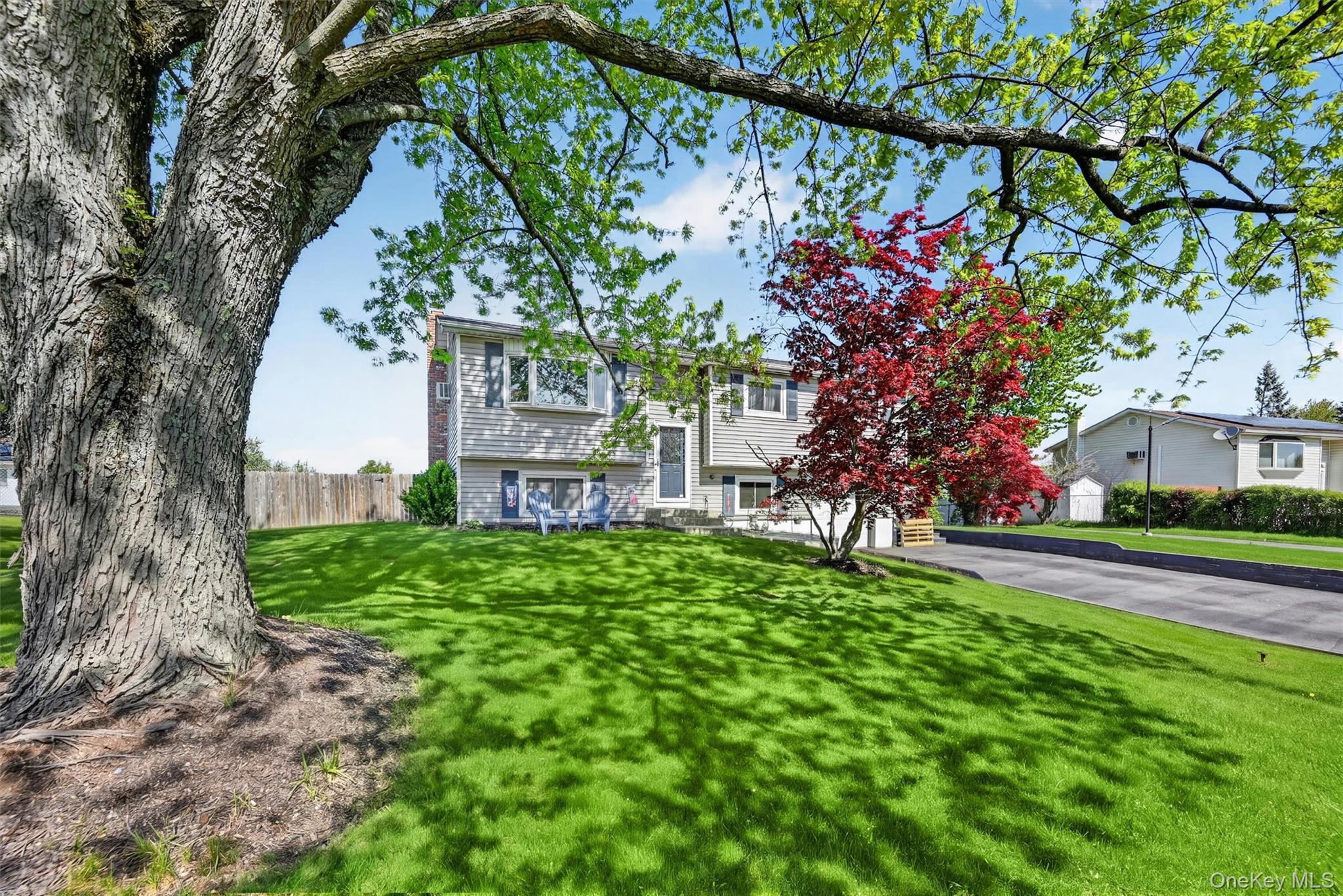 122 Rolling Meadows Road Middletown, NY 10940 - Photo 2 of 47 a front view of a house with garden