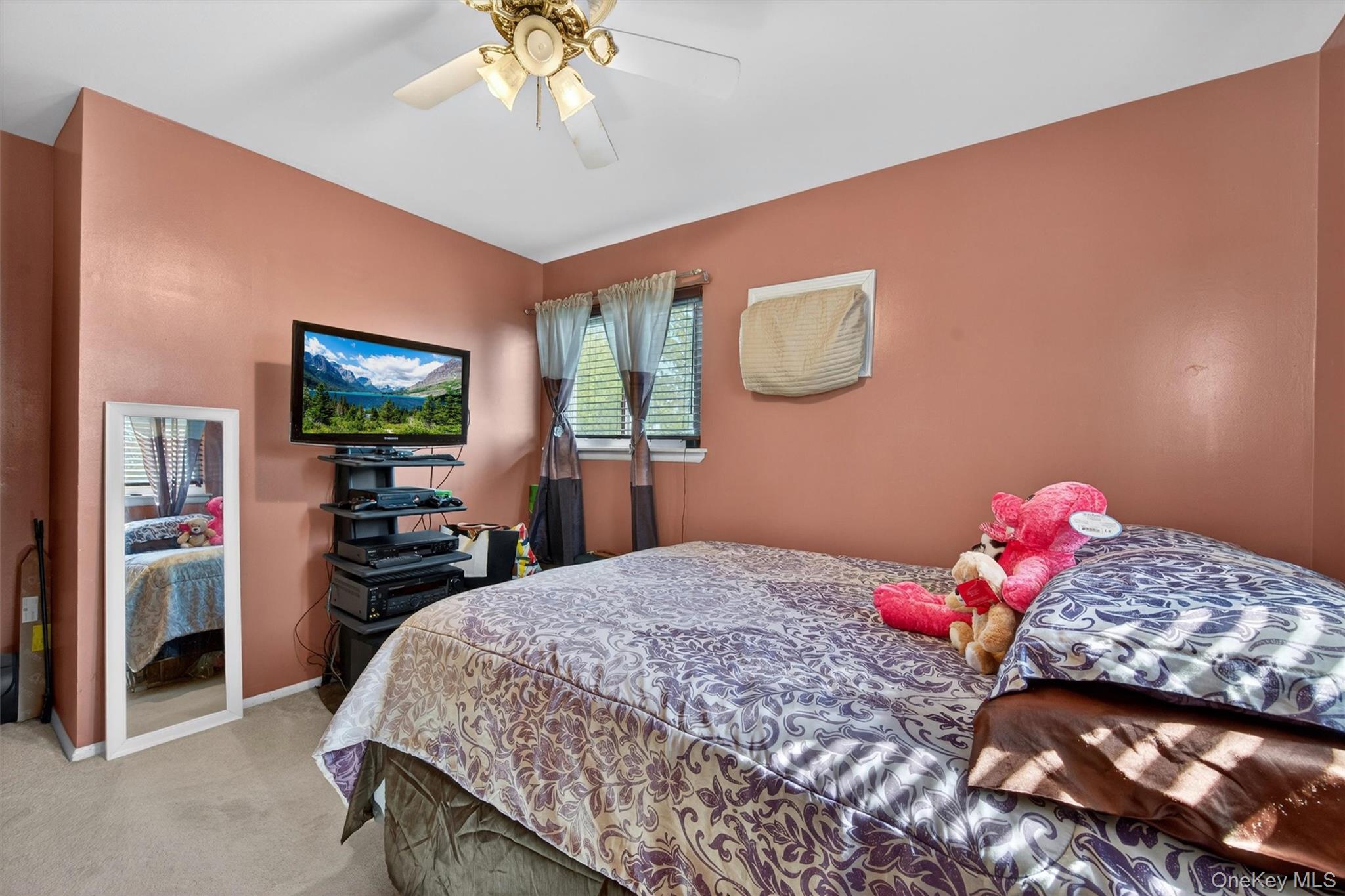 122 Rolling Meadows Road Middletown, NY 10940 - Photo 21 of 47 a bedroom with a bed and a chandelier