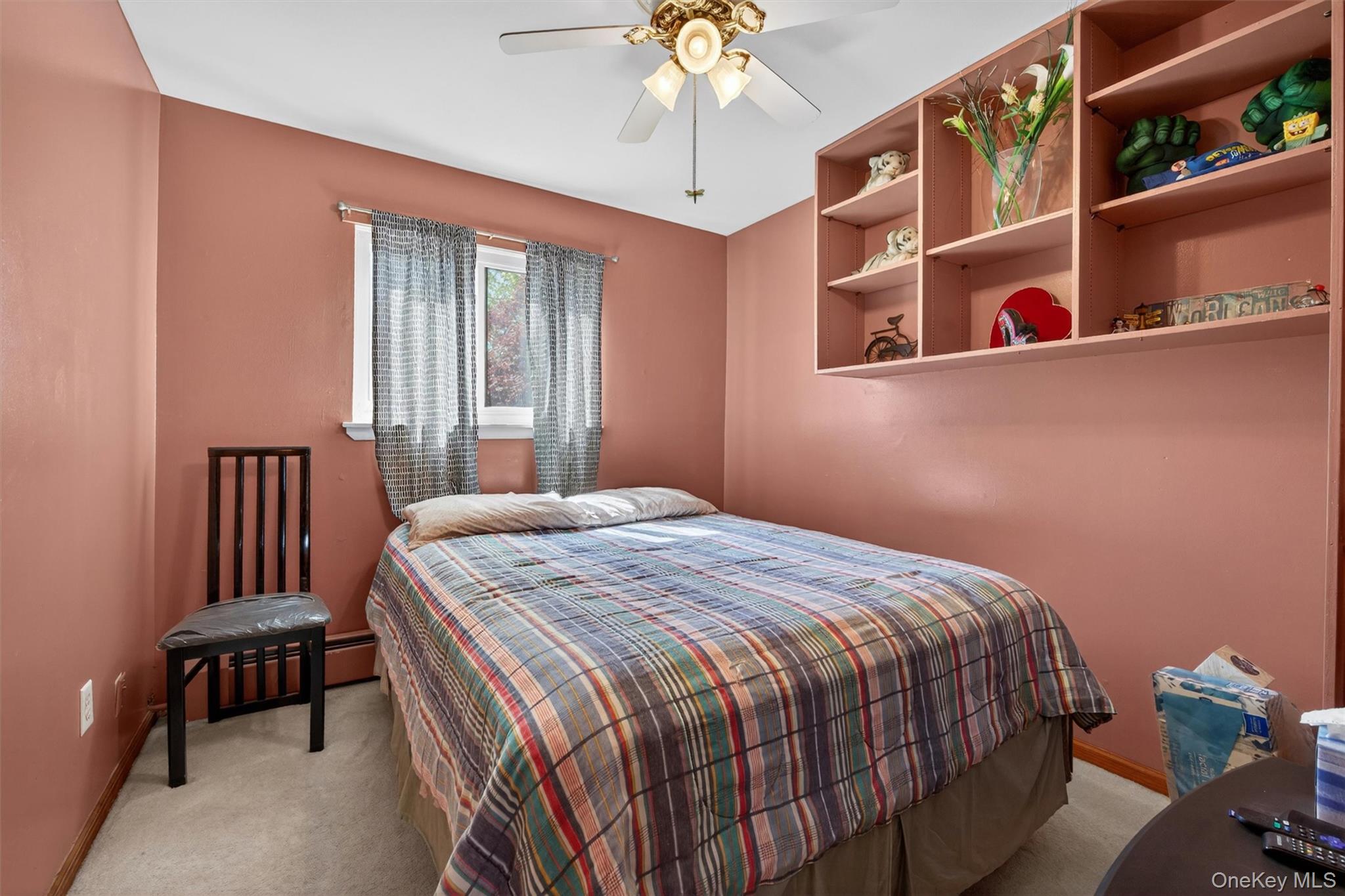 122 Rolling Meadows Road Middletown, NY 10940 - Photo 22 of 47 a bedroom with a bed and a chandelier
