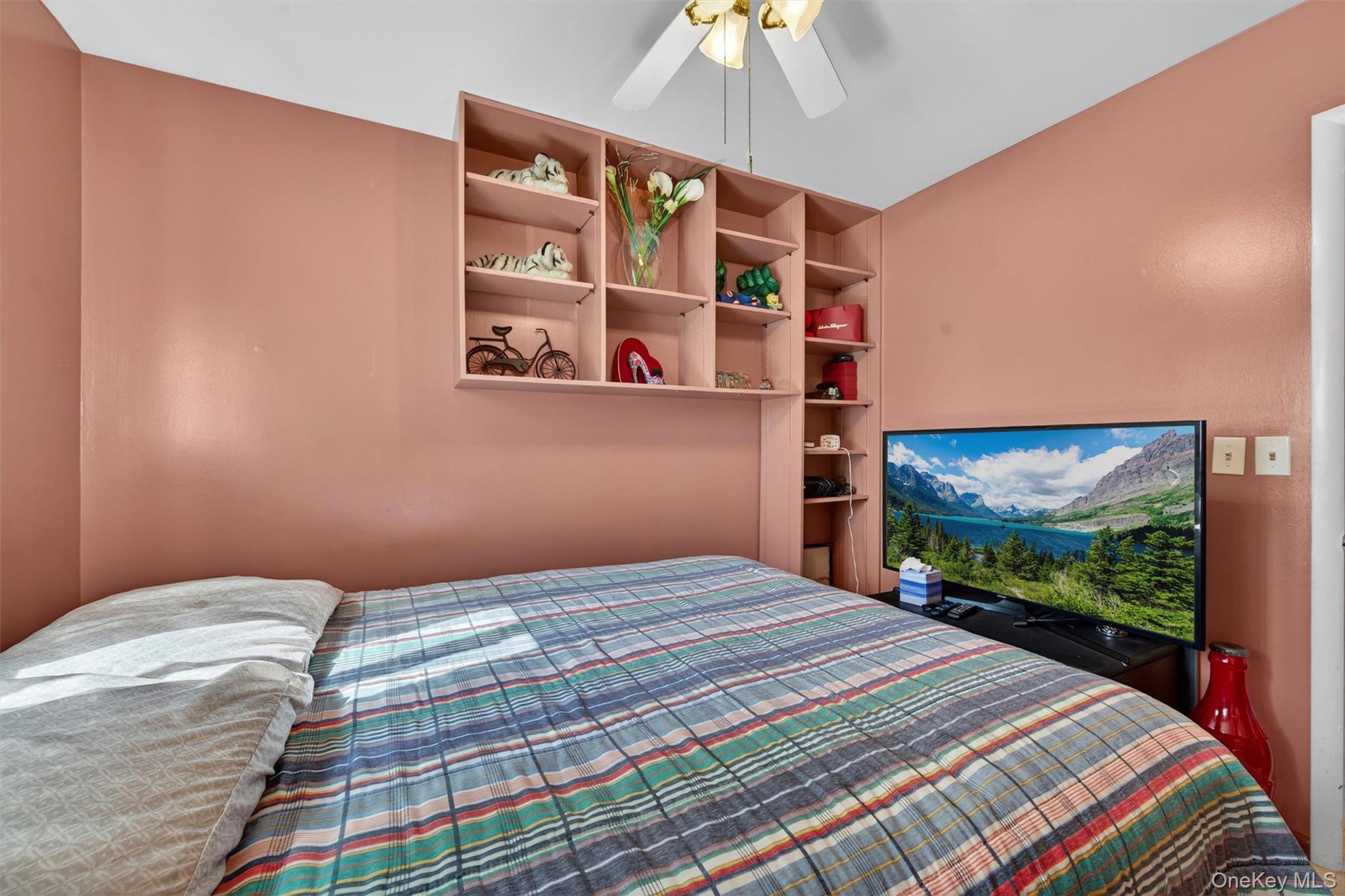 122 Rolling Meadows Road Middletown, NY 10940 - Photo 23 of 47 a bedroom with a bed and a flat screen tv