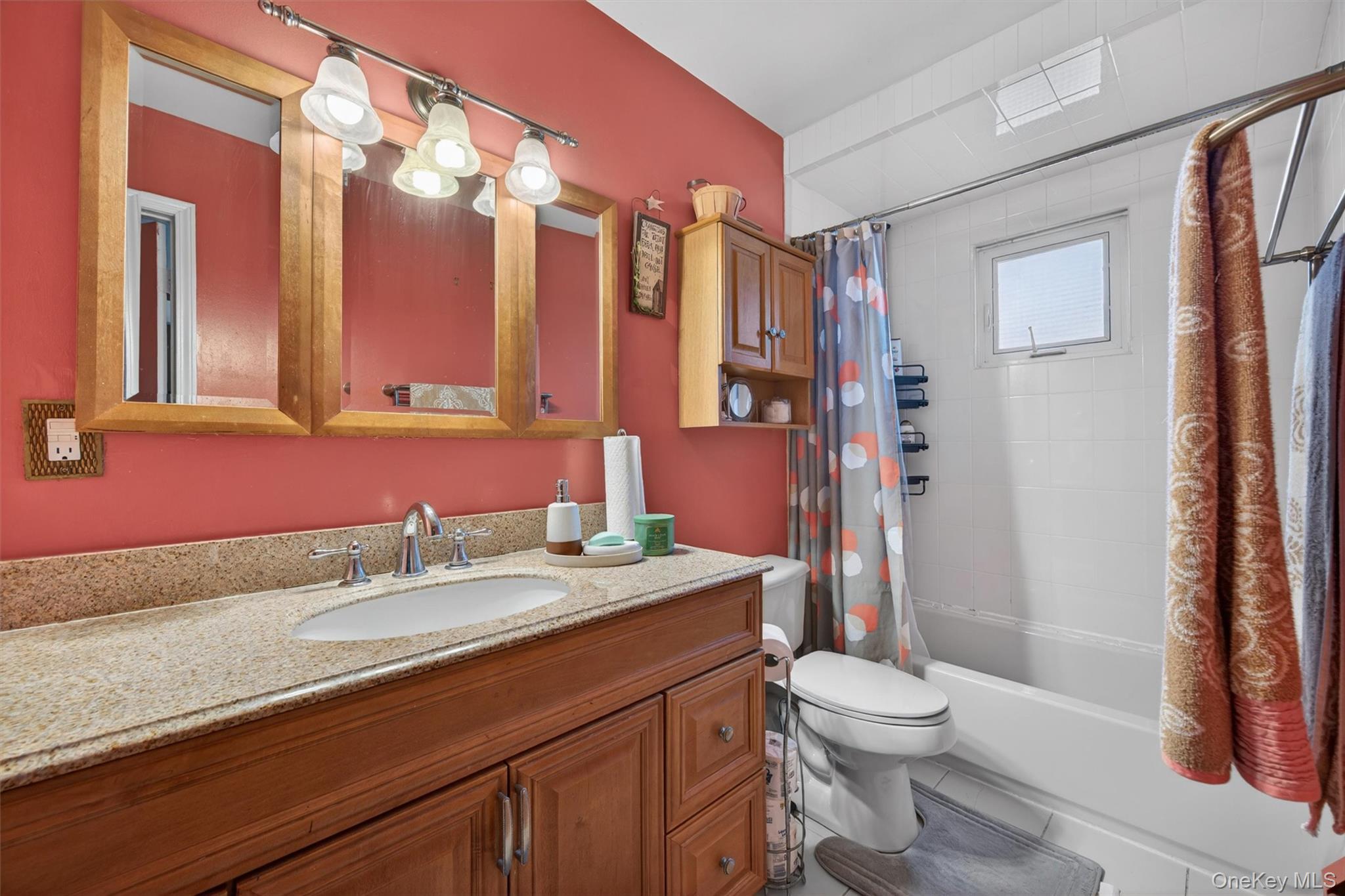 122 Rolling Meadows Road Middletown, NY 10940 - Photo 24 of 47 a bathroom with a sink a toilet a mirror a vanity and shower