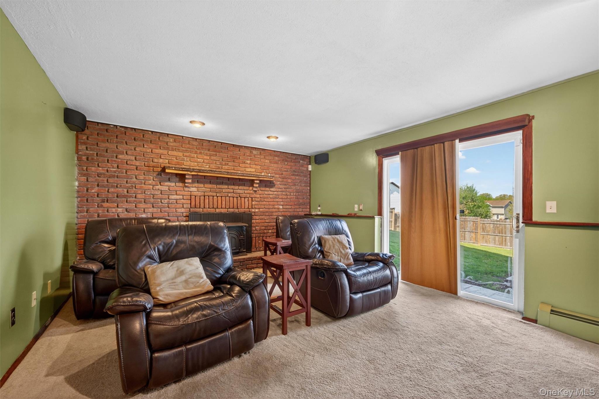122 Rolling Meadows Road Middletown, NY 10940 - Photo 25 of 47 a living room with furniture a floor to ceiling window and a flat screen tv