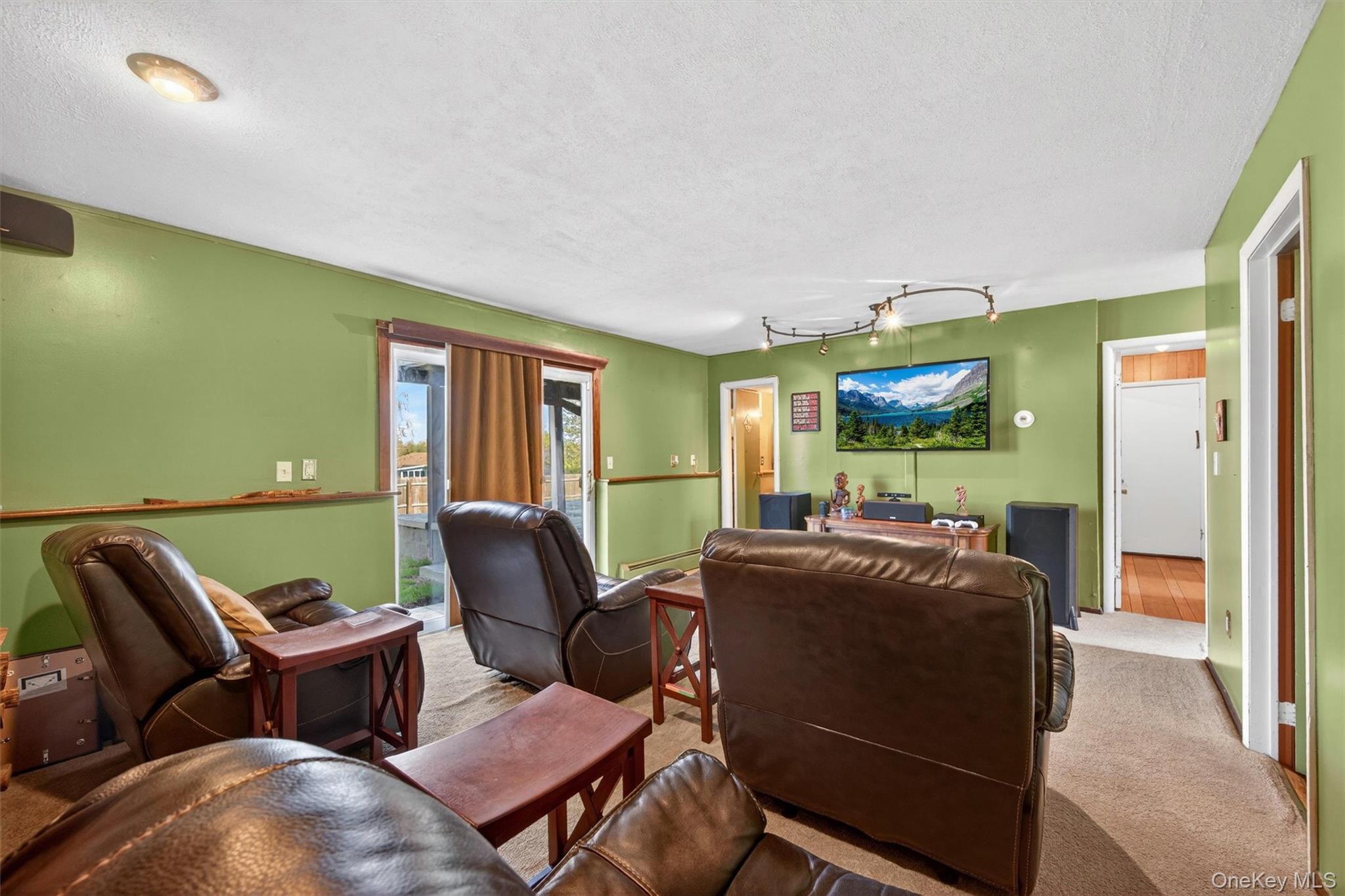 122 Rolling Meadows Road Middletown, NY 10940 - Photo 28 of 47 a living room with furniture a fireplace and a large window