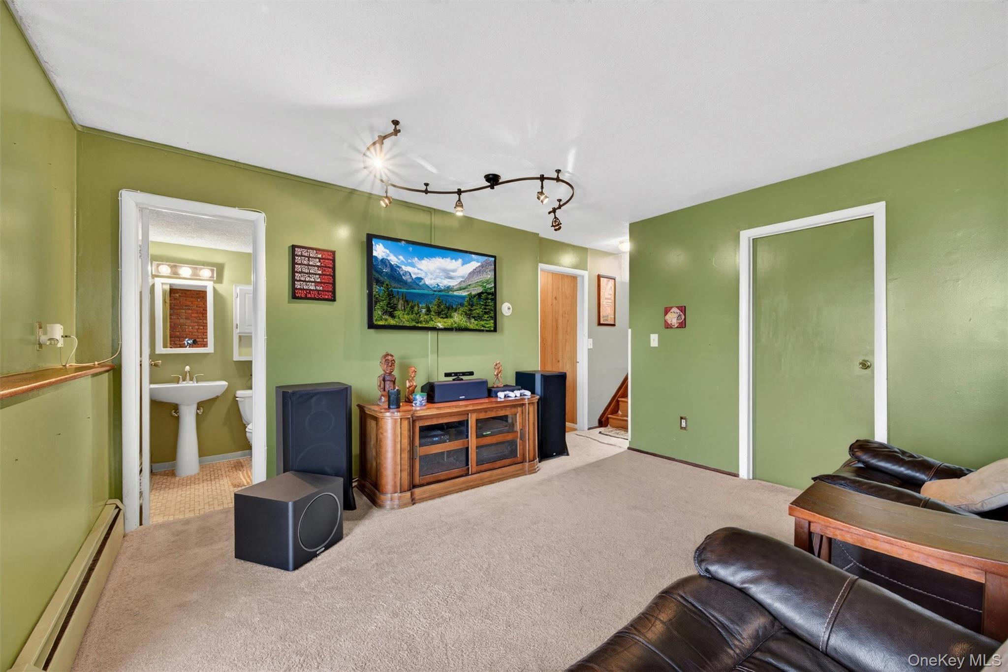 122 Rolling Meadows Road Middletown, NY 10940 - Photo 29 of 47 a living room with furniture and a flat screen tv