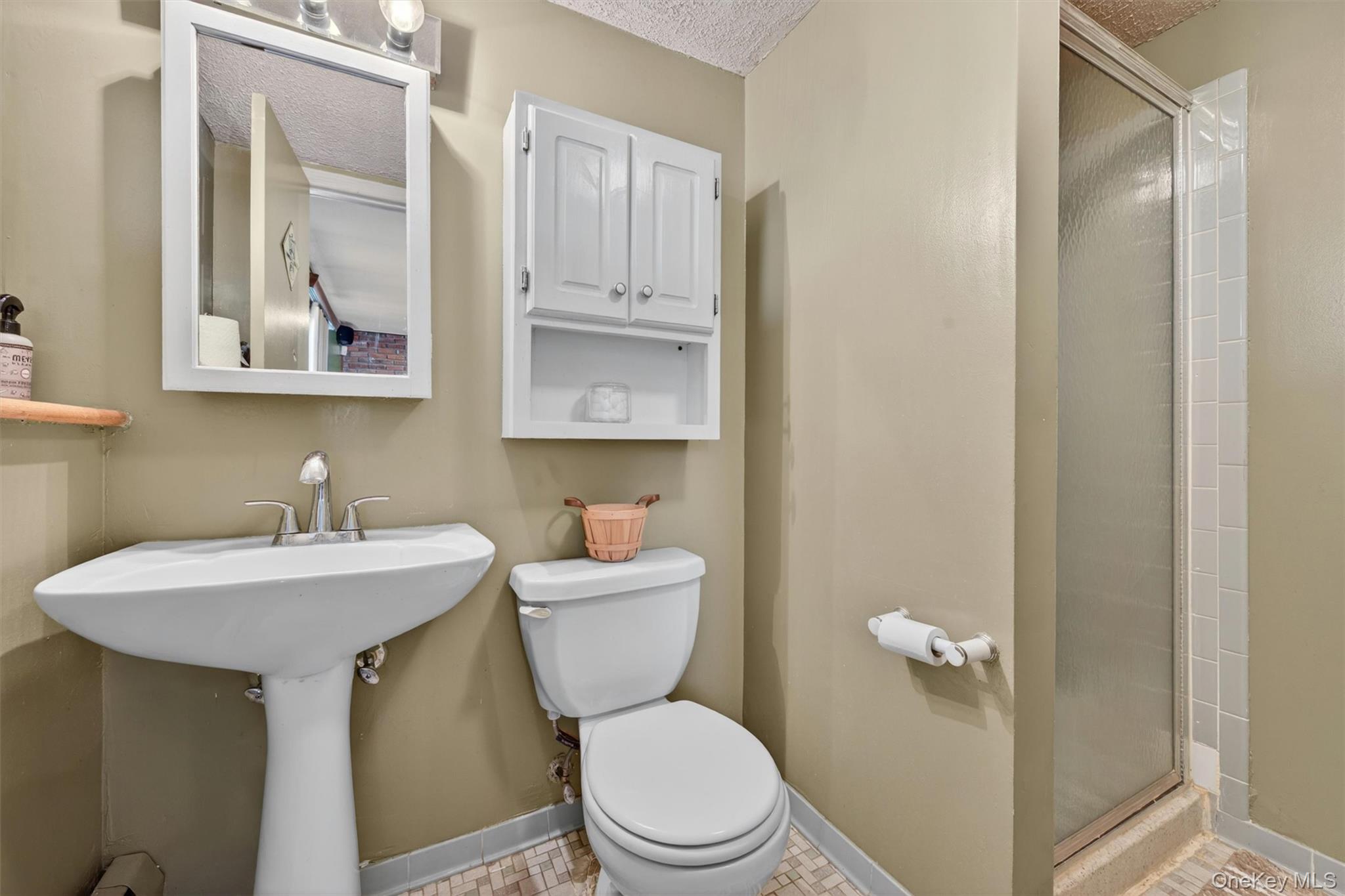 122 Rolling Meadows Road Middletown, NY 10940 - Photo 30 of 47 a bathroom with a toilet a sink and mirror