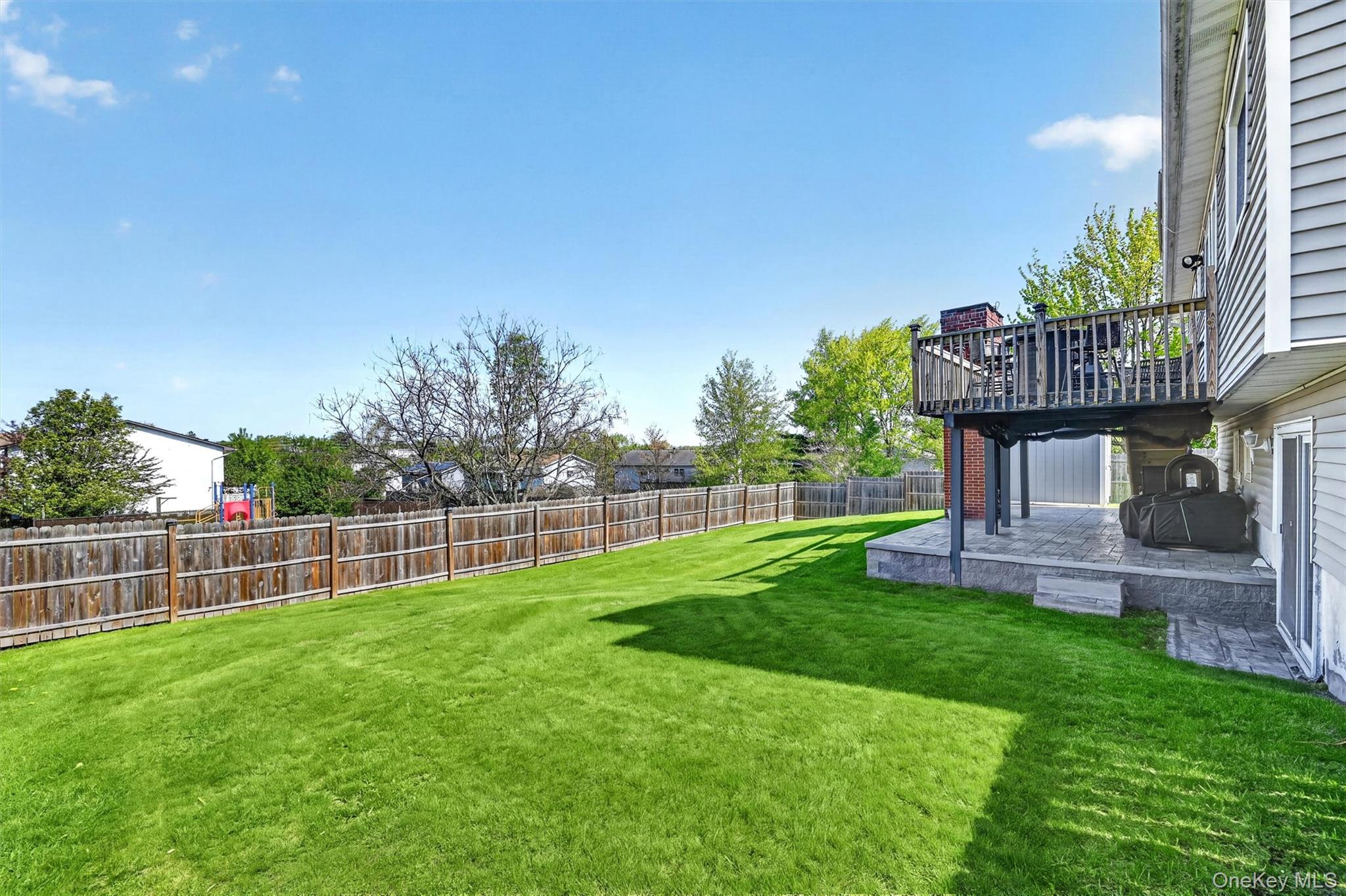 122 Rolling Meadows Road Middletown, NY 10940 - Photo 40 of 47 a view of a table and chairs in the garden