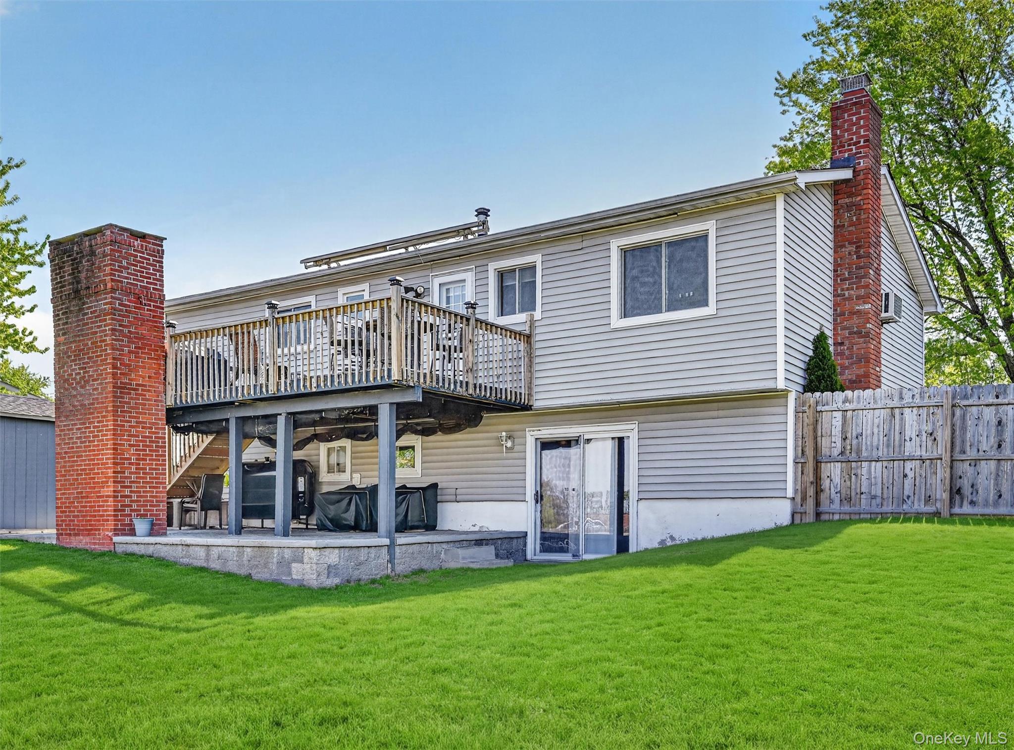 122 Rolling Meadows Road Middletown, NY 10940 - Photo 41 of 47 a view of a house with a yard and sitting area