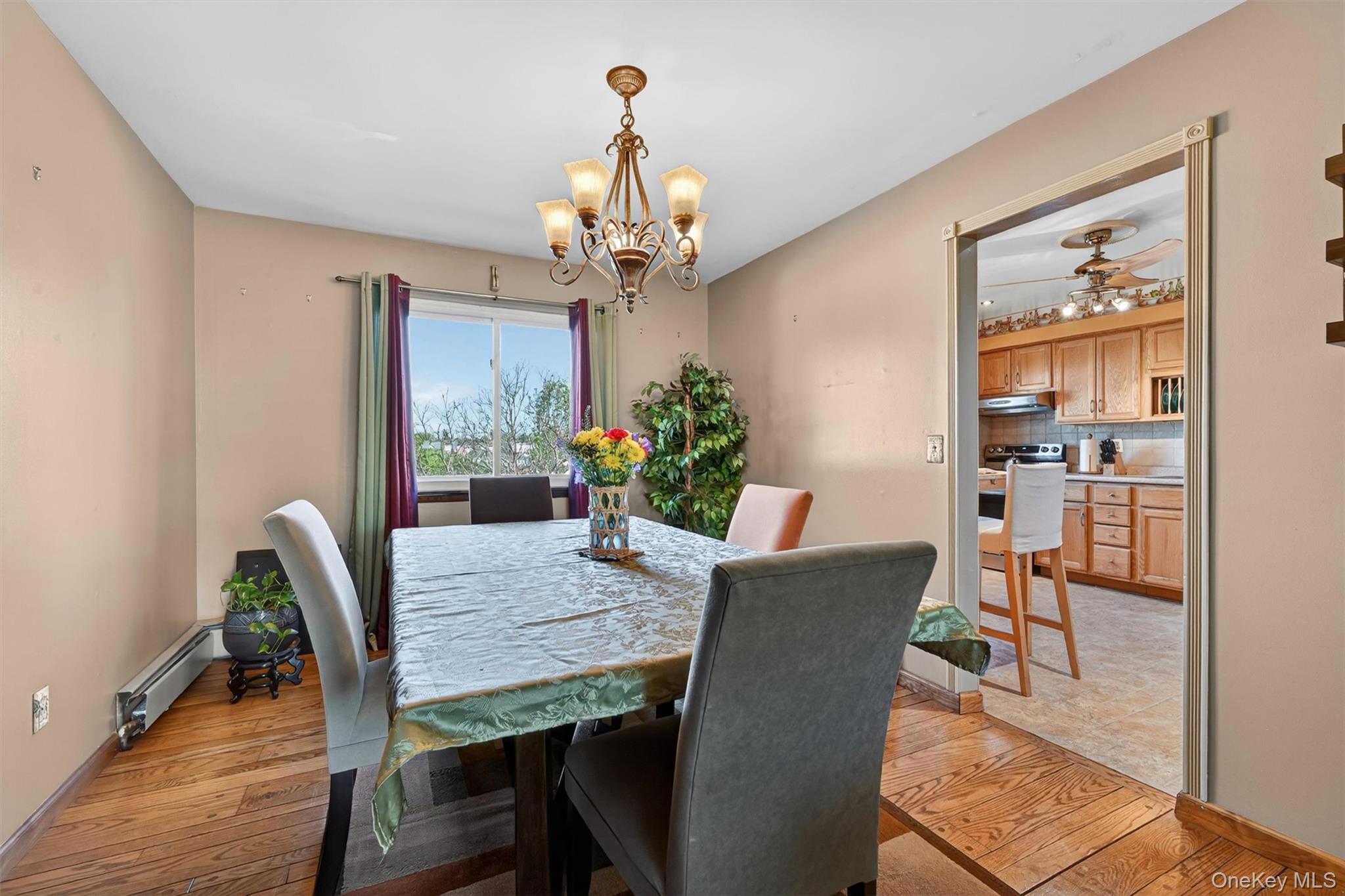 122 Rolling Meadows Road Middletown, NY 10940 - Photo 5 of 47 a view of a dining room with furniture a chandelier and wooden floor