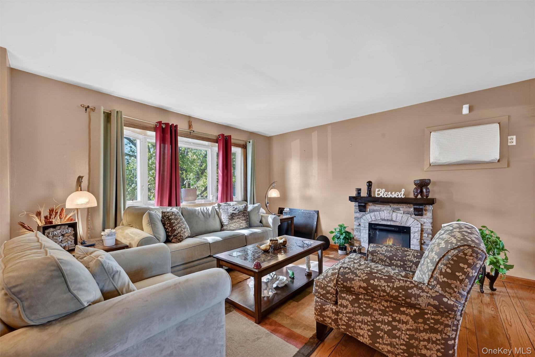 122 Rolling Meadows Road Middletown, NY 10940 - Photo 6 of 47 a living room with furniture and a fireplace