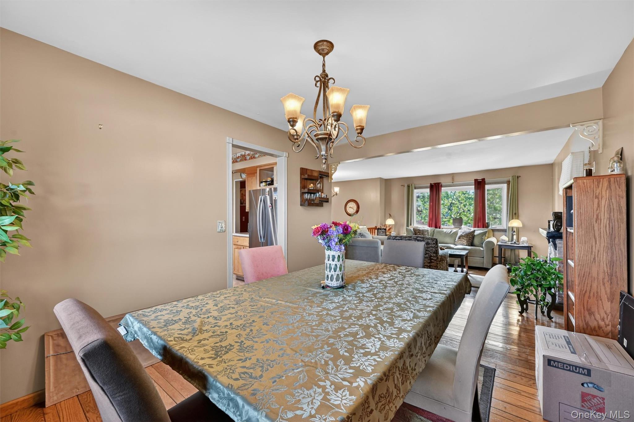 122 Rolling Meadows Road Middletown, NY 10940 - Photo 10 of 47 a view of a dining room with furniture a chandelier and wooden floor
