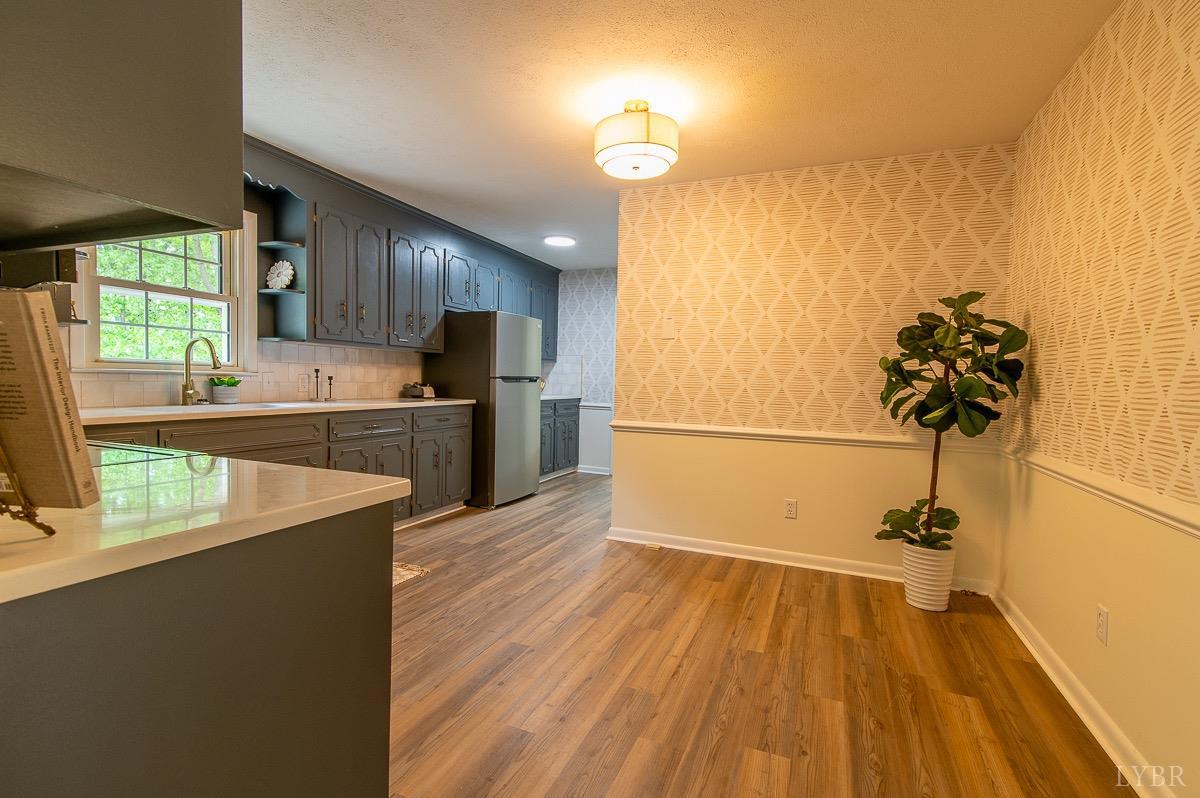 219 Izaak Walton Road Amherst, VA 24521 - Photo 11 of 32 a view of a kitchen with wooden floor and electronic appliances