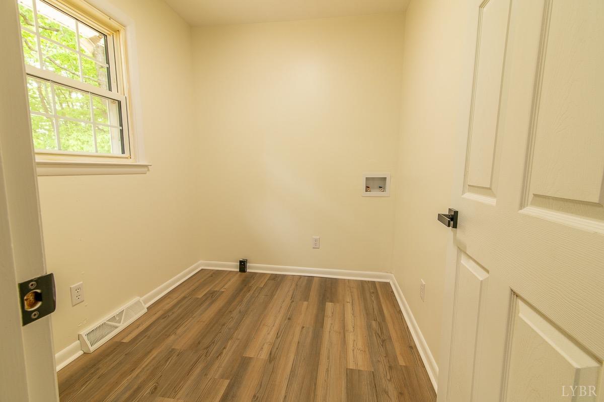 219 Izaak Walton Road Amherst, VA 24521 - Photo 13 of 32 a bathroom with a sink and a window