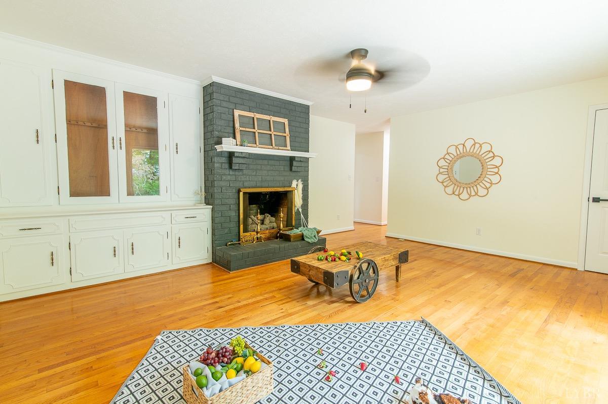 219 Izaak Walton Road Amherst, VA 24521 - Photo 14 of 32 a bedroom with a bed and a fireplace