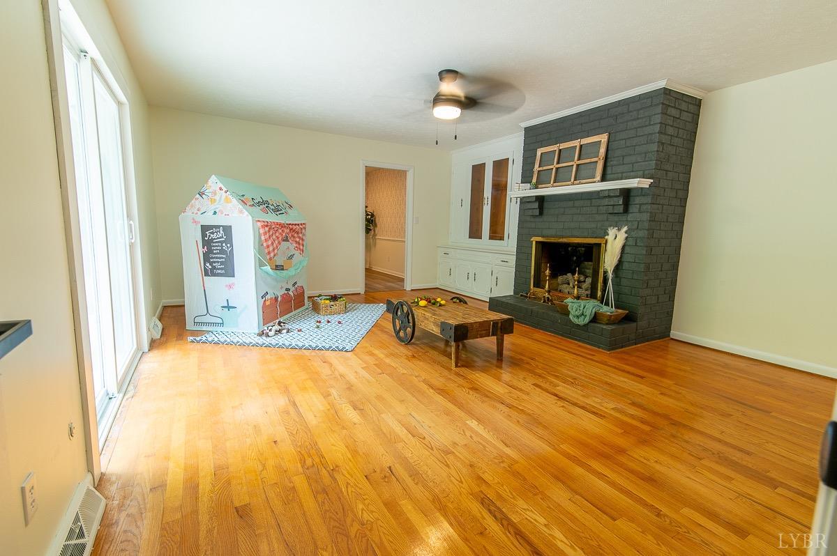 219 Izaak Walton Road Amherst, VA 24521 - Photo 15 of 32 a view of a livingroom with furniture and a fireplace