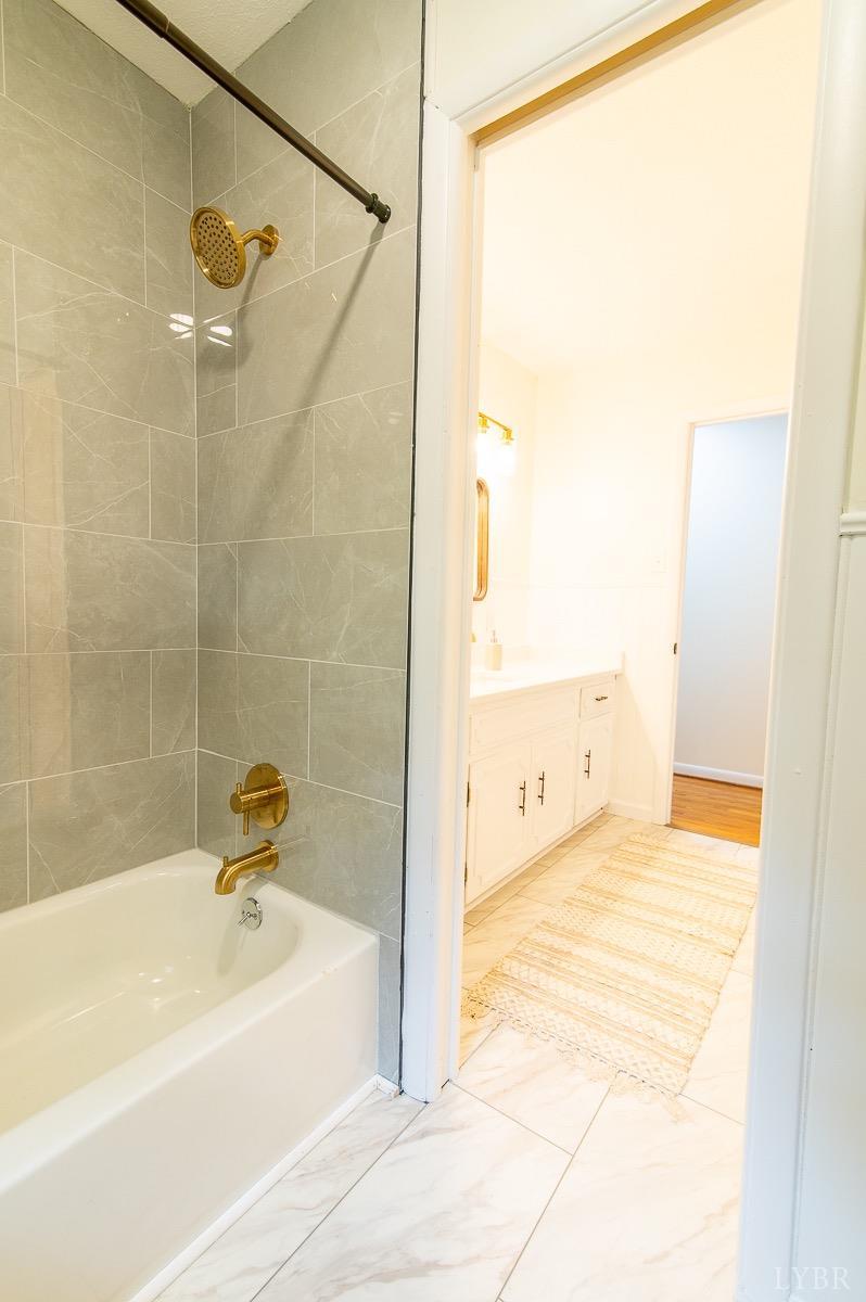 219 Izaak Walton Road Amherst, VA 24521 - Photo 19 of 32 a bathroom with a tub and a shower