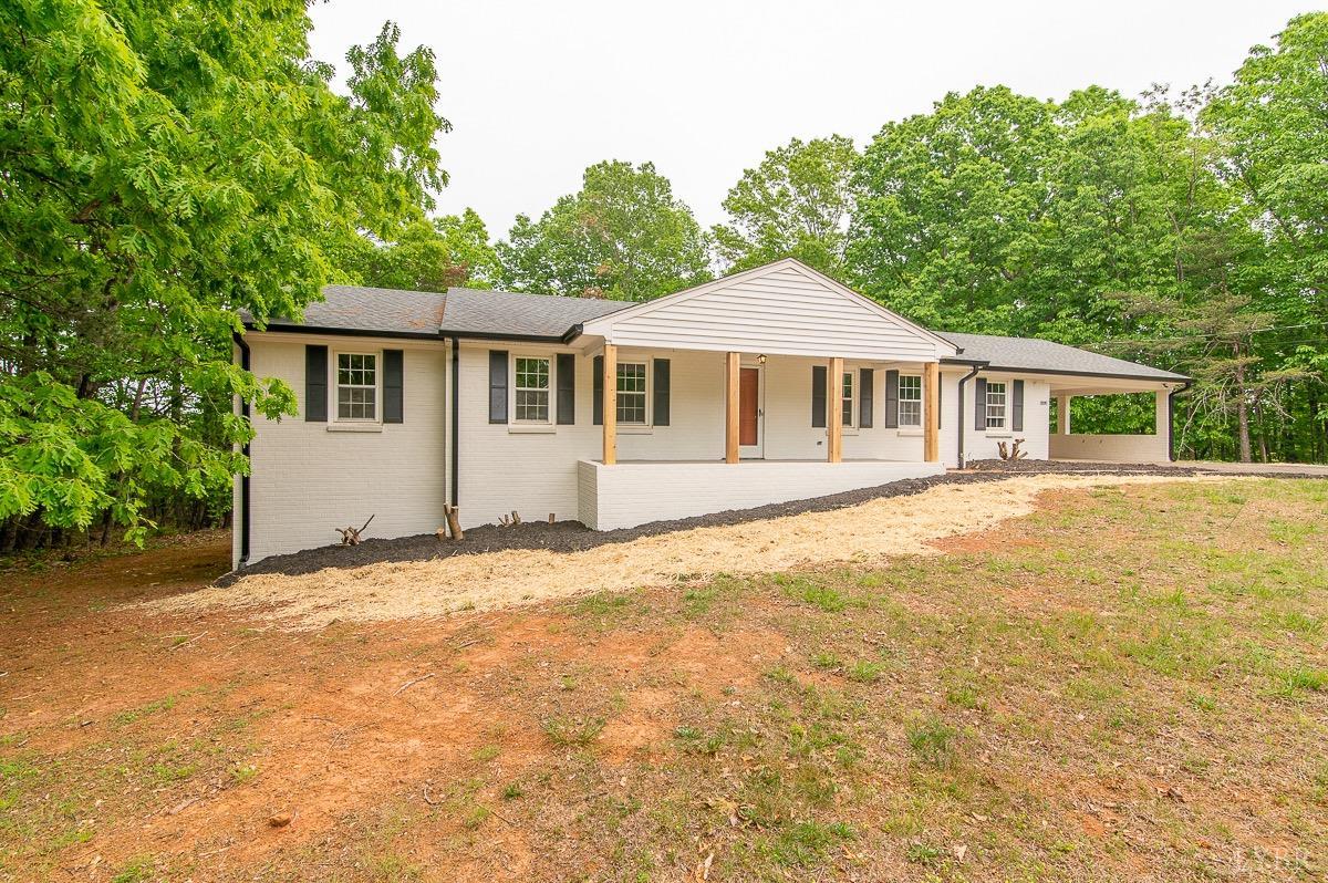 219 Izaak Walton Road Amherst, VA 24521 - Photo 2 of 32 a front view of a house with a garden