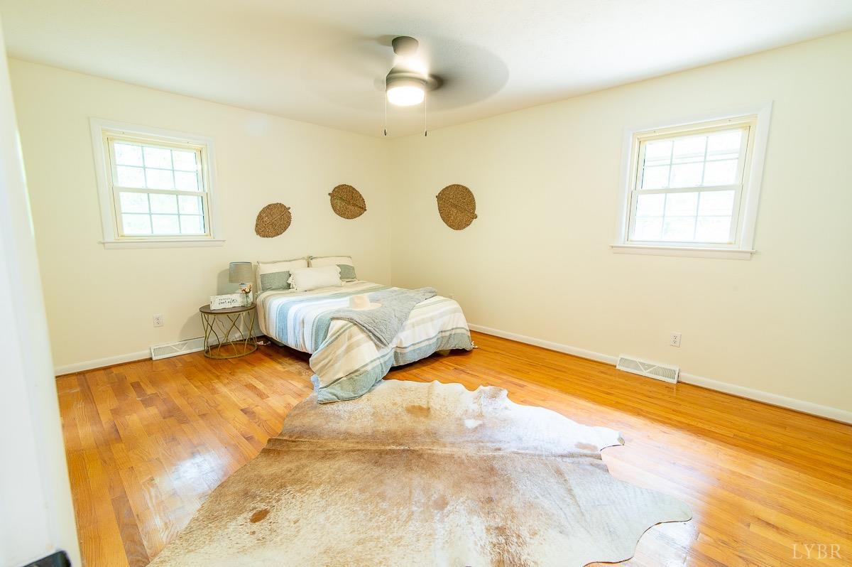 219 Izaak Walton Road Amherst, VA 24521 - Photo 22 of 32 a bedroom with a bed and a window