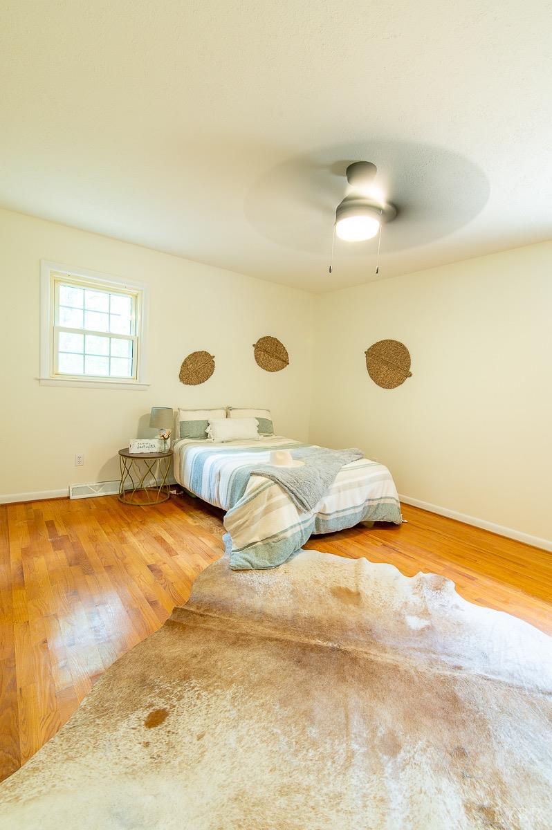 219 Izaak Walton Road Amherst, VA 24521 - Photo 23 of 32 a bedroom with a bed and a dresser