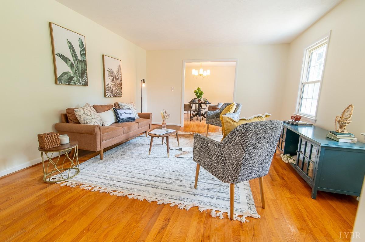 219 Izaak Walton Road Amherst, VA 24521 - Photo 5 of 32 a living room with furniture and a wooden floor