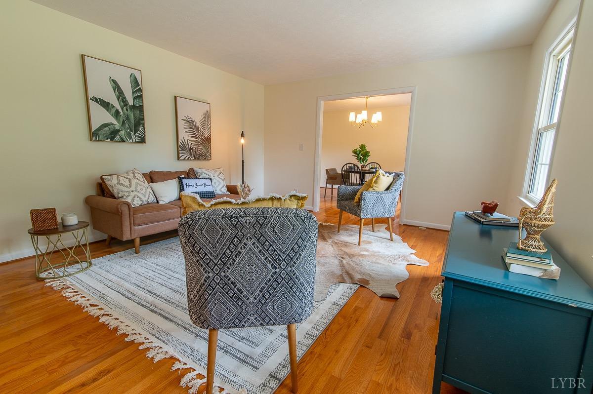 219 Izaak Walton Road Amherst, VA 24521 - Photo 7 of 32 a living room with furniture and a wooden floor