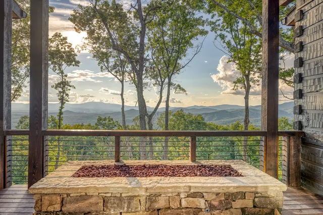 a outdoor living space with patio furniture and a fireplace