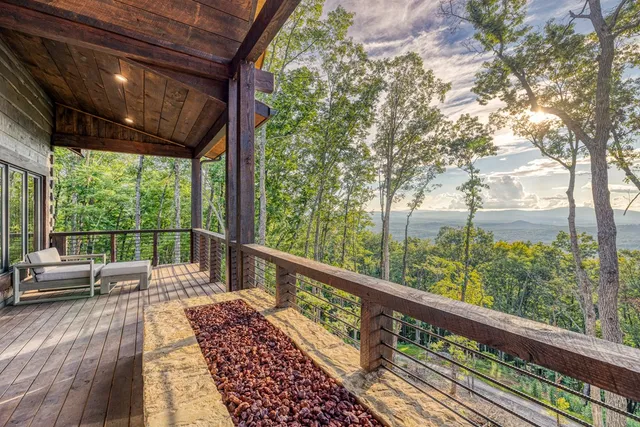 a kitchen with stainless steel appliances granite countertop a sink and wooden floor