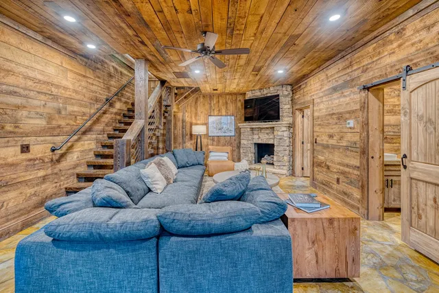 a bedroom with furniture and large windows