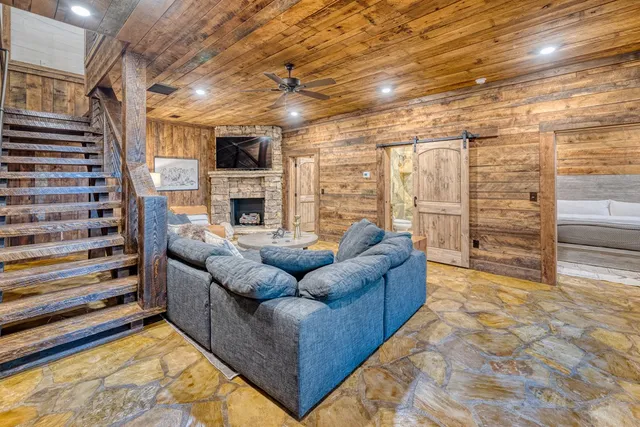 a backyard of a house with yard fountain and outdoor seating