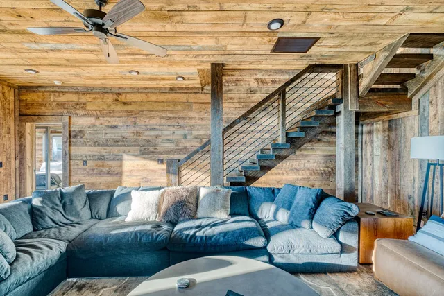 a front view of a house with a yard glass windows and kitchen view