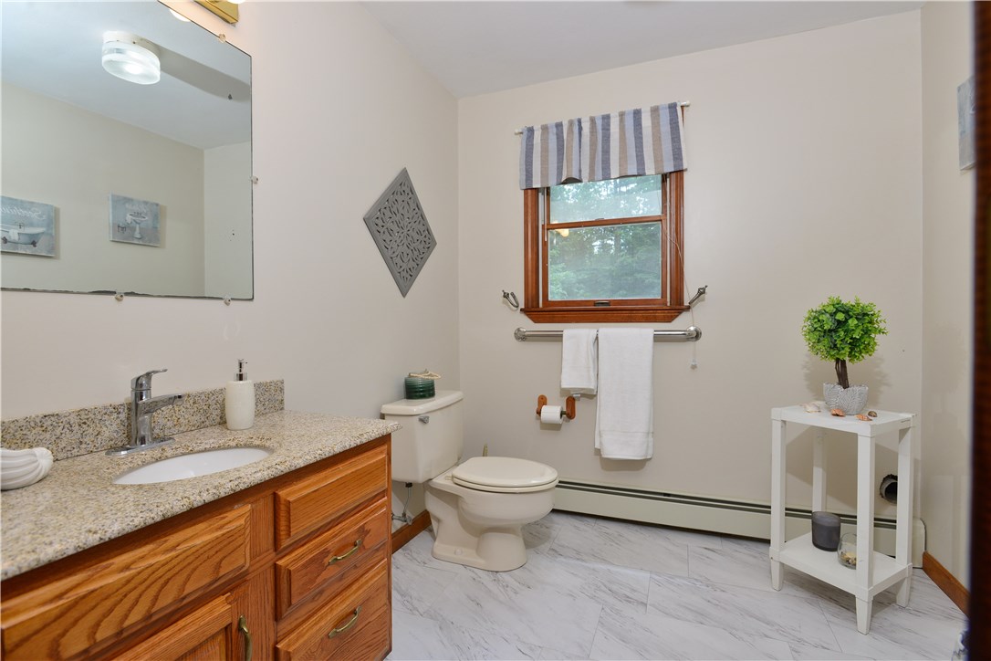 157 Widow Sweets Road Exeter, RI 02822 - Photo 12 of 28 1st floor half bath with laundry hook up