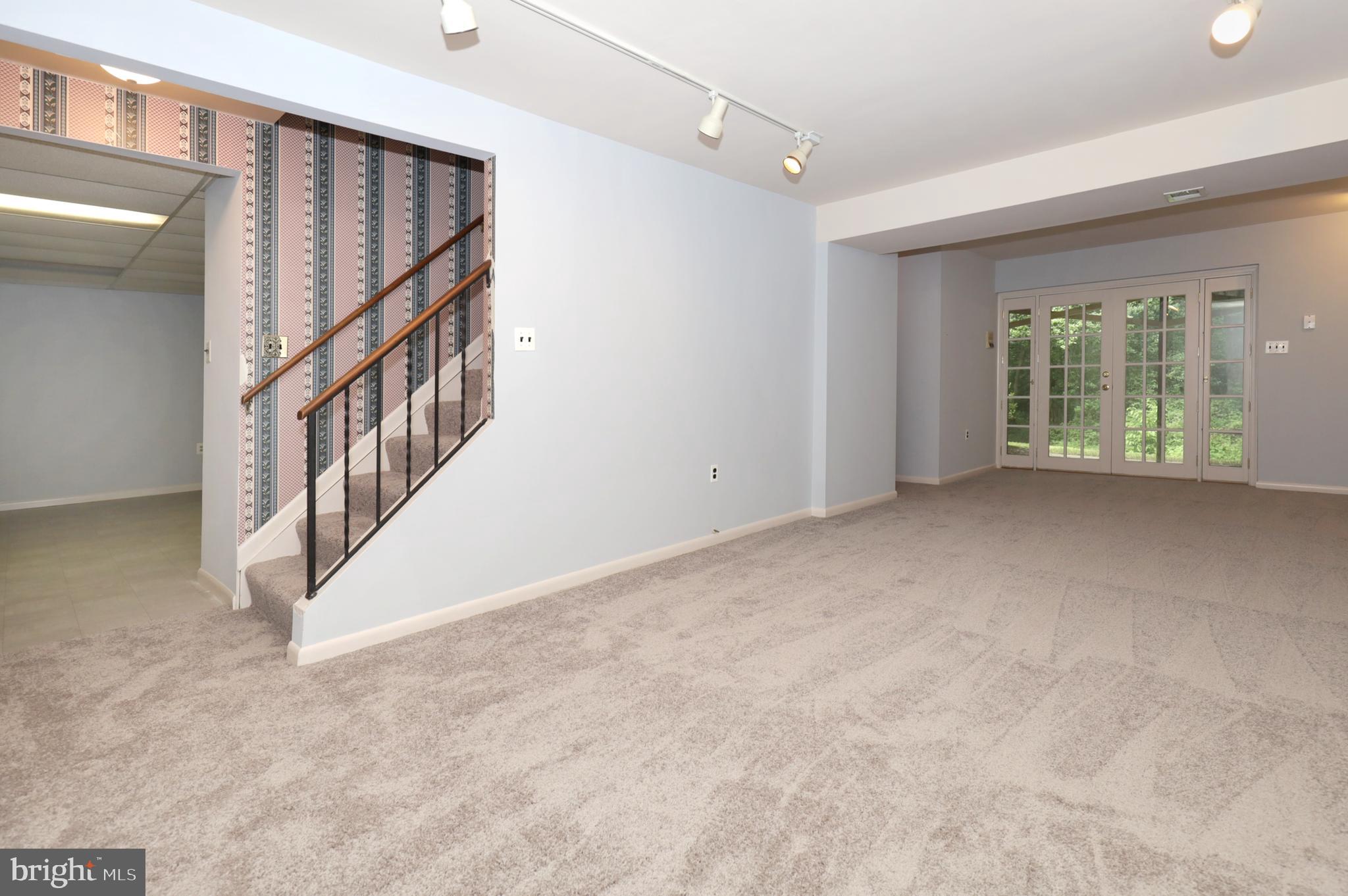 9925 Natick Road Burke, VA 22015 - Photo 52 of 66 lower level rec room, french doors to outside