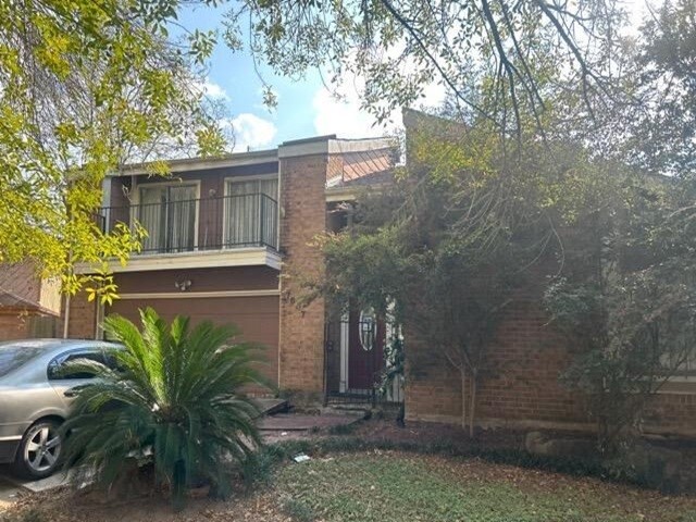 a view of a house with a tree