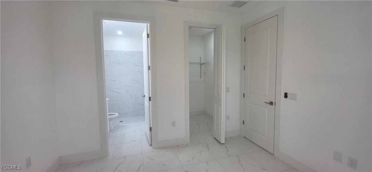 927 Chenault Street Lehigh Acres, FL 33974 - Photo 15 of 16 a view of an empty room