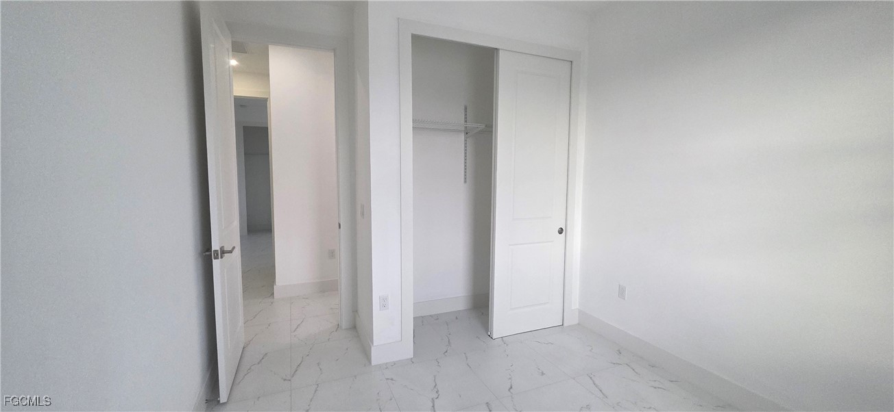 927 Chenault Street Lehigh Acres, FL 33974 - Photo 10 of 16 a view of an empty room