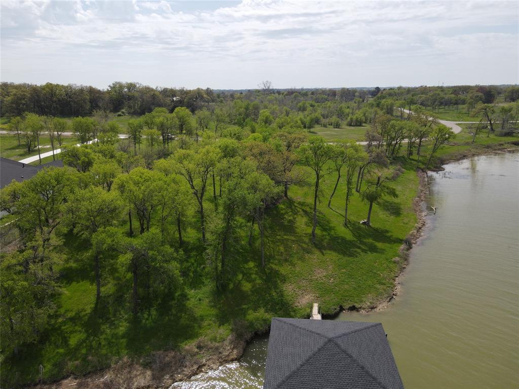 117 Diamond Point Drive Corsicana, TX 75109 - Photo 14 of 35 a view of a lake with a yard