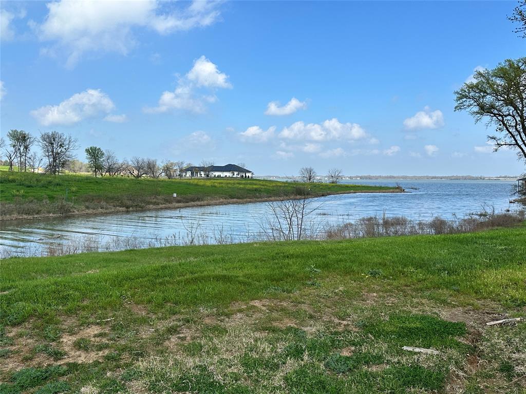 117 Diamond Point Drive Corsicana, TX 75109 - Photo 23 of 35 a view of a lake from a yard
