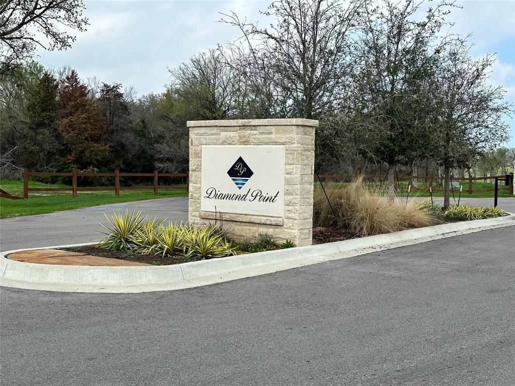 117 Diamond Point Drive Corsicana, TX 75109 - Photo 33 of 35 a view of a park with a bench and trees