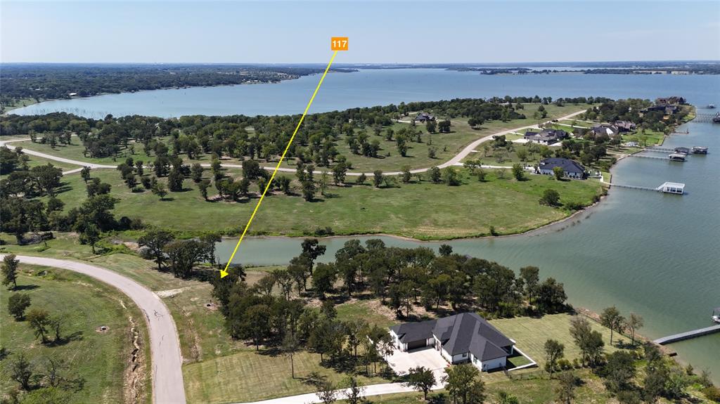117 Diamond Point Drive Corsicana, TX 75109 - Photo 6 of 35 an aerial view of a house with a yard and lake view