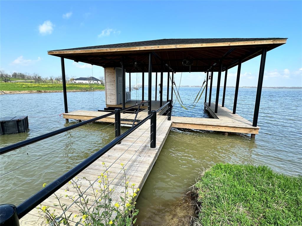 117 Diamond Point Drive Corsicana, TX 75109 - Photo 9 of 35 a view of a swimming pool with a patio