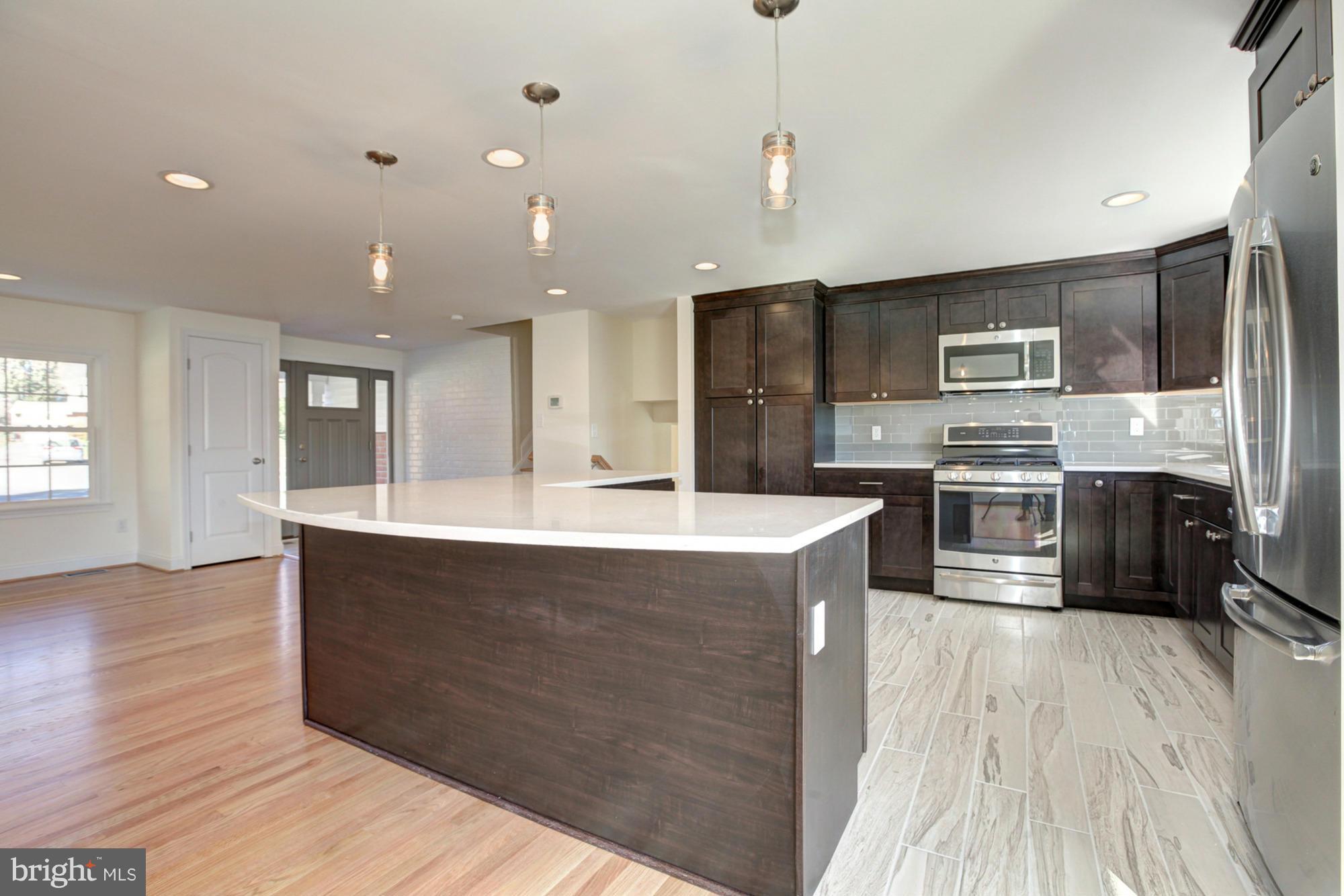 249 Coldbrook Road Lutherville-Timonium, MD 21093 - Photo 11 of 30 Pendant lighting, breakfast bar