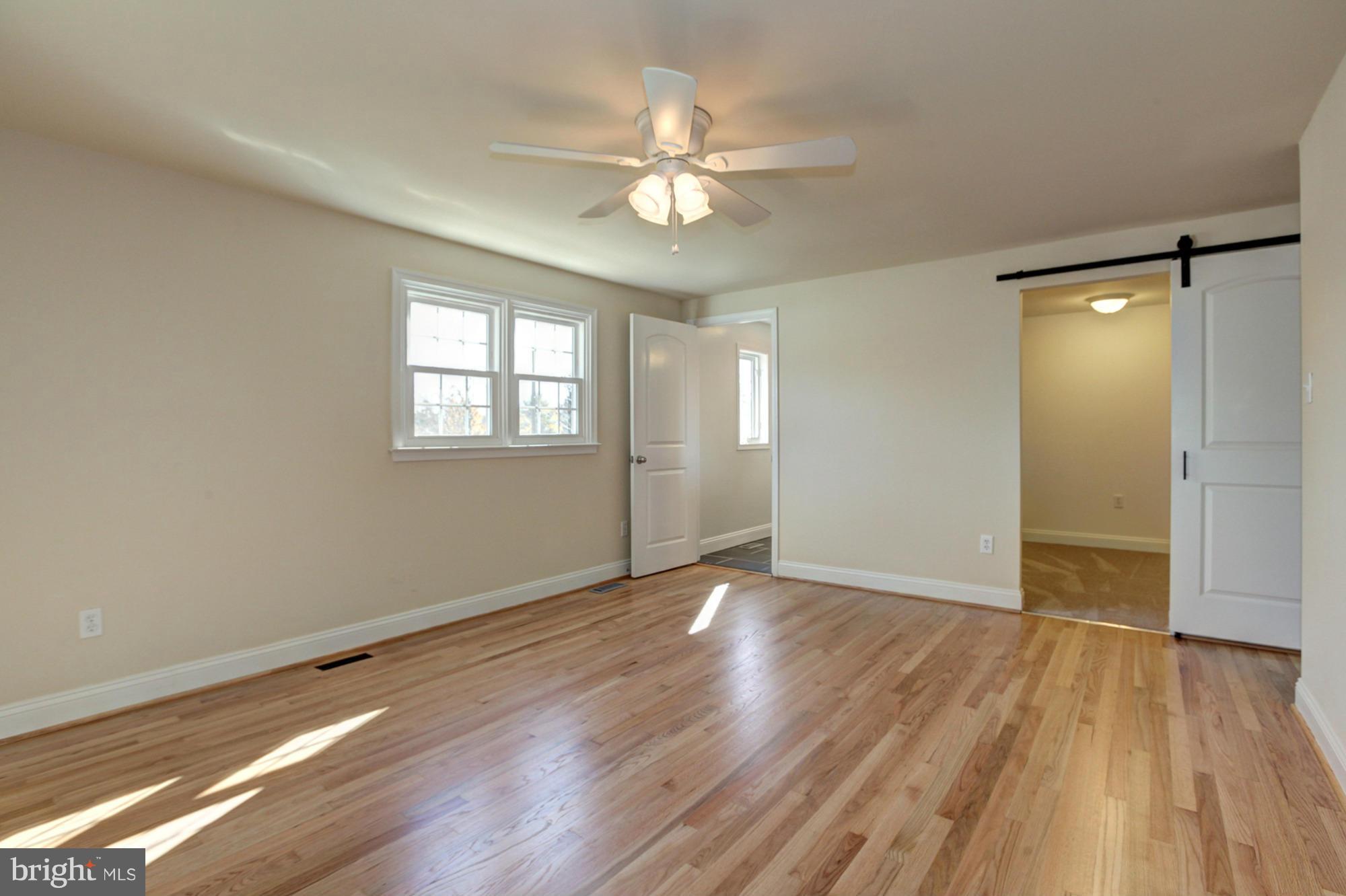 249 Coldbrook Road Lutherville-Timonium, MD 21093 - Photo 24 of 30 Barn door leads to walk in closet with custom stor