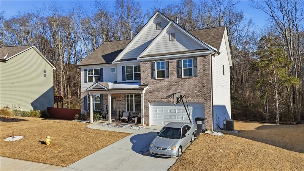 175 Paxton Lane Jefferson, GA 30549 - Photo 4 of 39 a front view of a house with yard and trees