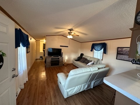 8800 South Harlem Avenue, Unit 809 Bridgeview, IL 60455 - Photo 3 of 14 a living room with furniture and a wooden floor